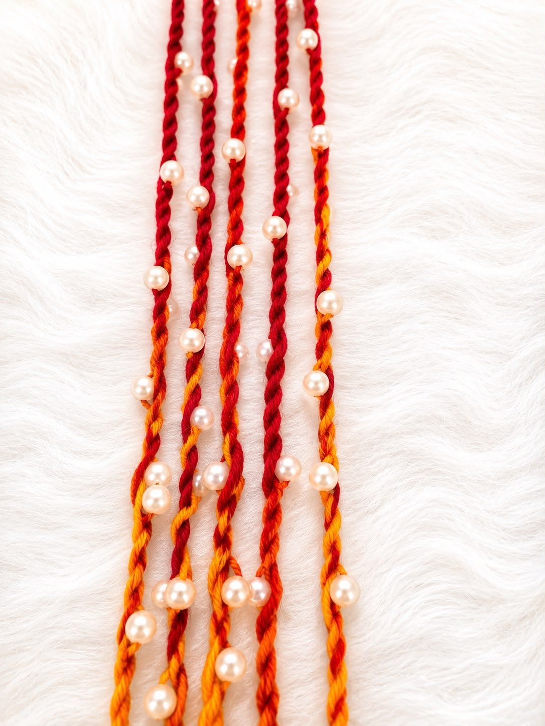 Moli Rakhi With White Pearls(Set of 5)